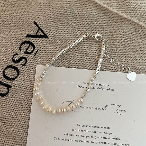 �Broken Silver Pearl Necklace